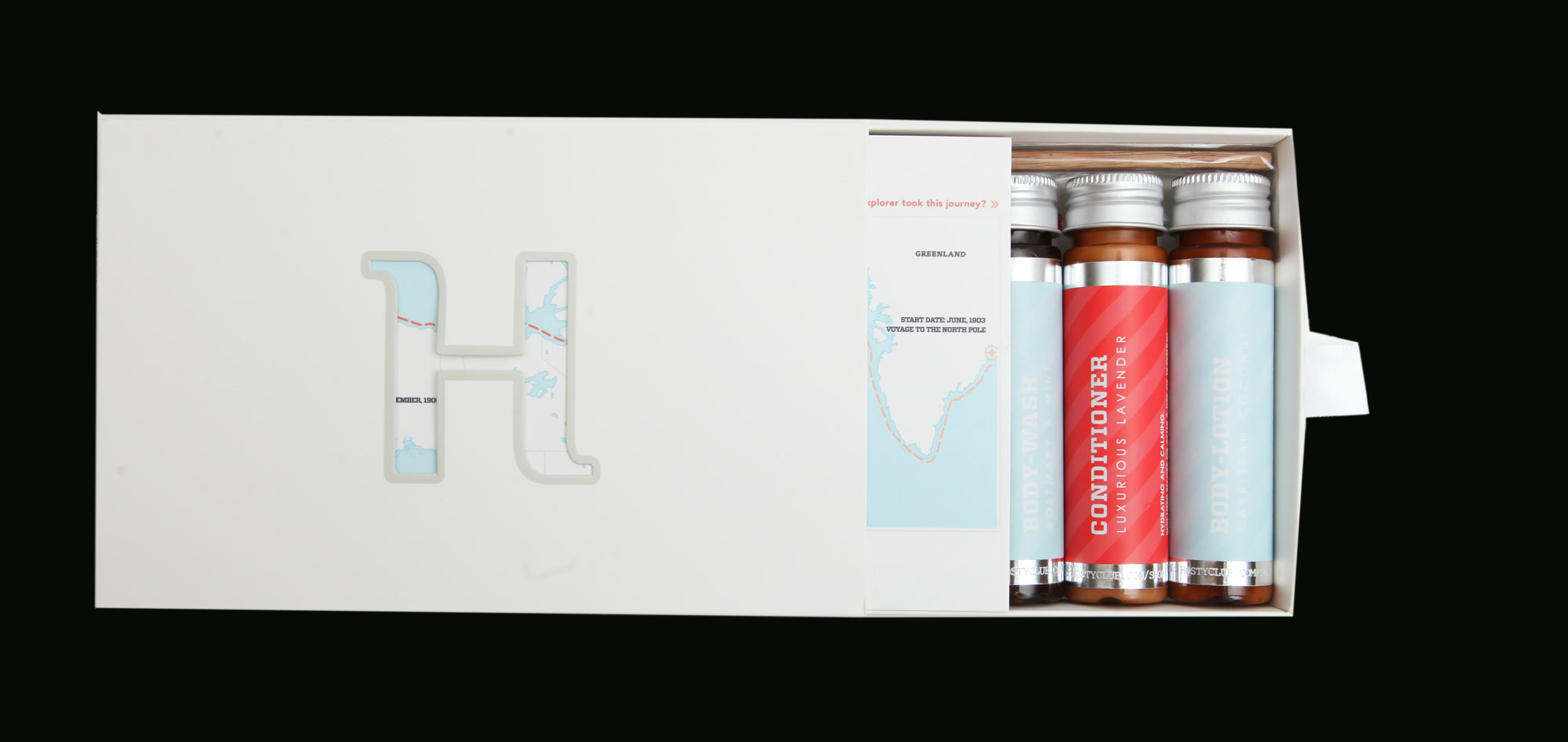 The final Hosty drawer partially open, revealing local map inserts and individually labeled amber toiletries