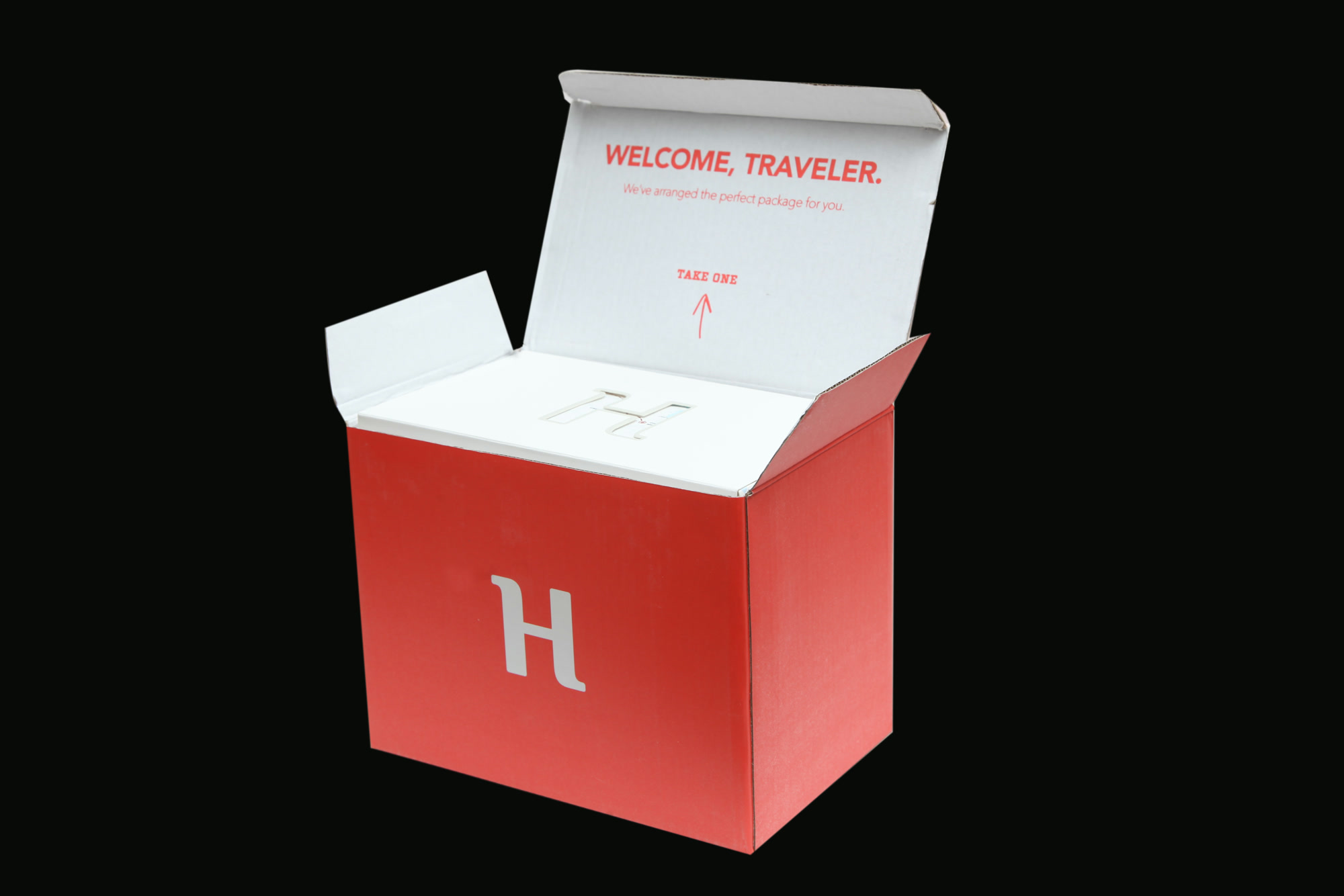 The complete Hosty shipping box open with Welcome, Traveler printed inside the lid